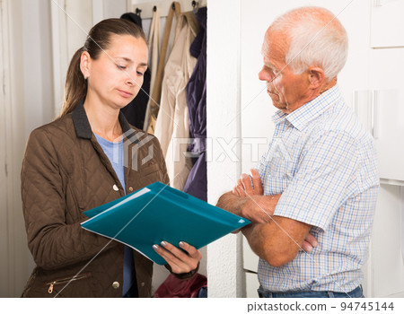 Female collector is trying to get the arrears from mature man at home door Female collector is trying to get the arrears from mature man at home door 94745144