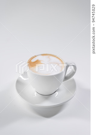 tasty italian latte coffee with straw and saucer isolated on white background 94745829