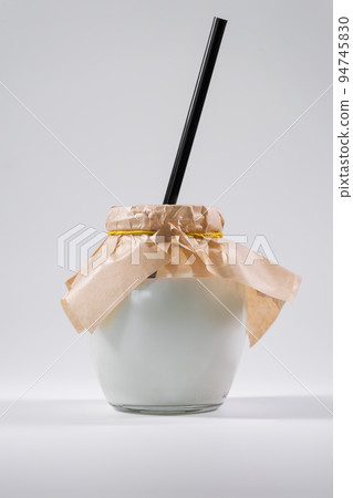 bowl with tasty yogurt or dairy product, milkshake isolated on white background 94745830