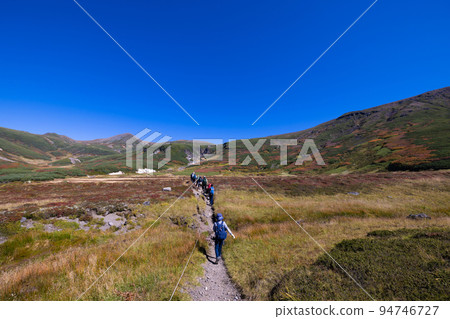 Child climbing Asahidake in autumn Child climbing Asahidake in autumn 94746727