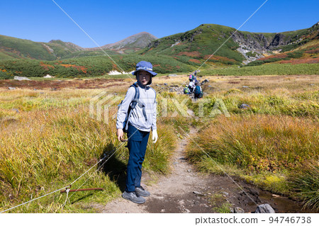Child climbing Daisetsuzan Mt. Nakadake Child climbing Daisetsuzan Mt. Nakadake 94746738