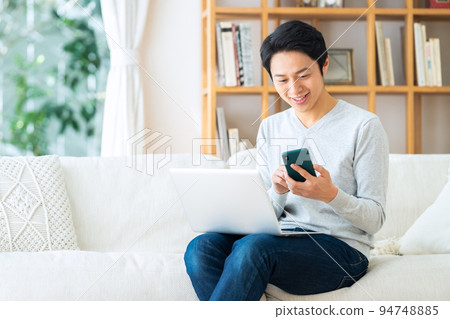 Telework remote work personal computer male living lifestyle Telework remote work personal computer male living lifestyle 94748885