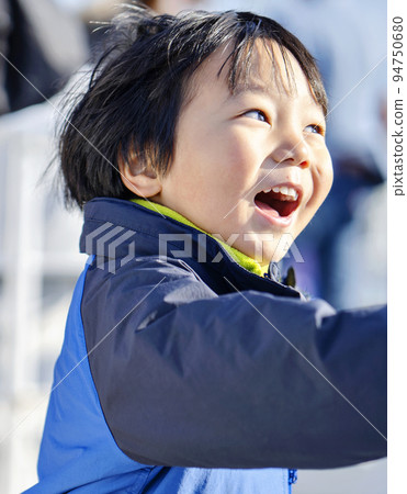 A cute boy with a very happy smile 94750680