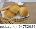 Fresh fragrant bread and bun on the table with copy space. Food concept 94752984