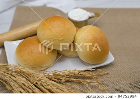 Fresh fragrant bread and bun on the table with copy space. Food concept Fresh fragrant bread and bun on the table with copy space. Food concept 94752984