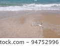 Plastic water bottles pollution on beach (Environment concept) 94752996