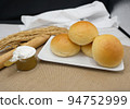 Fresh fragrant bread and bun on the table with copy space. Food concept 94752999