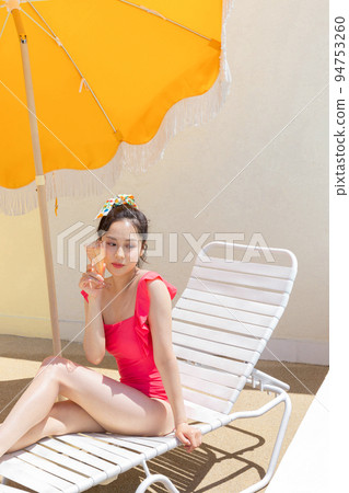 summer vacation concept_korean beautiful asian young woman sitting take a rest on the sunbed summer vacation concept_korean beautiful asian young woman sitting take a rest on the sunbed 94753260
