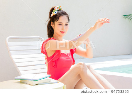summer vacation concept_korean beautiful asian young woman applying, wearing sunblock summer vacation concept_korean beautiful asian young woman applying, wearing sunblock 94753265