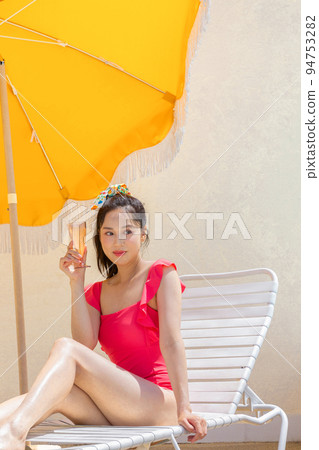 summer vacation concept_korean beautiful asian young woman sitting take a rest on the sunbed summer vacation concept_korean beautiful asian young woman sitting take a rest on the sunbed 94753282