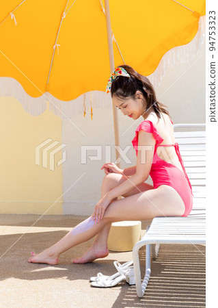 summer vacation concept_korean beautiful asian young woman applying, wearing sunblock summer vacation concept_korean beautiful asian young woman applying, wearing sunblock 94753323