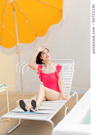 summer vacation concept_korean beautiful asian young woman covering face by hand of bright sunlight summer vacation concept_korean beautiful asian young woman covering face by hand of bright sunlight 94753336