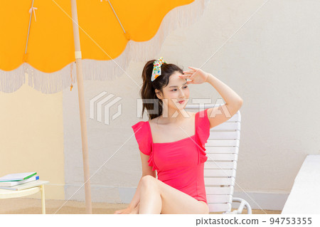 summer vacation concept_korean beautiful asian young woman covering face by hand of bright sunlight summer vacation concept_korean beautiful asian young woman covering face by hand of bright sunlight 94753355