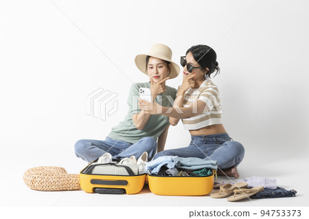 preparing for a summer trip concept series_korean beautiful asian young women taking a selfie preparing for a summer trip concept series_korean beautiful asian young women taking a selfie 94753373