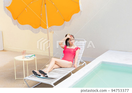 summer vacation concept_korean beautiful asian young woman covering face by hand of bright sunlight summer vacation concept_korean beautiful asian young woman covering face by hand of bright sunlight 94753377