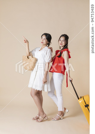 summer vacation trip with friends concept series_korean beautiful asian young women walking with carrier summer vacation trip with friends concept series_korean beautiful asian young women walking with carrier 94753489