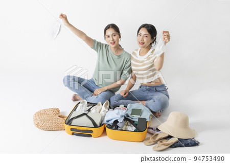 preparing for a summer trip concept series_korean beautiful asian young women holding masks preparing for a summer trip concept series_korean beautiful asian young women holding masks 94753490