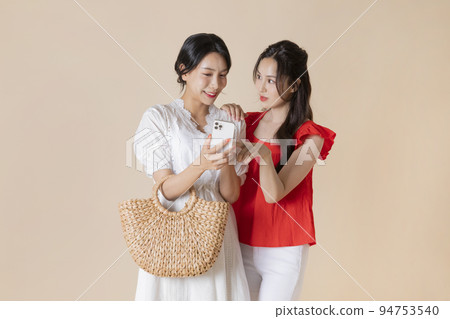 summer vacation trip with friends concept series_korean beautiful asian young women worrying watching smartphone summer vacation trip with friends concept series_korean beautiful asian young women worrying watching smartphone 94753540