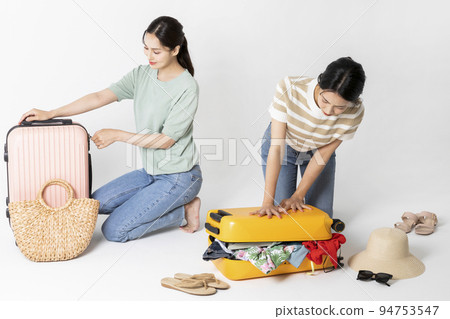 preparing for a summer trip concept series_korean beautiful asian young women packing for a trip preparing for a summer trip concept series_korean beautiful asian young women packing for a trip 94753547