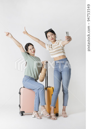 preparing for a summer trip concept series_korean beautiful asian young women taking a selfie preparing for a summer trip concept series_korean beautiful asian young women taking a selfie 94753549
