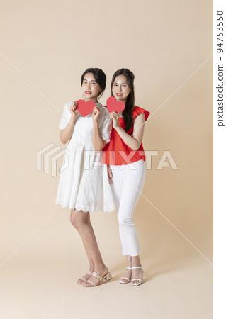 summer vacation trip with friends concept series_korean beautiful asian young women holding heart shape panels 94753550