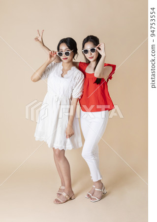summer vacation trip with friends concept series_korean beautiful asian young women wearing sunglasses having fun time 94753554