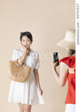 summer vacation trip with friends concept series_korean beautiful asian young women taking a photo 94753557