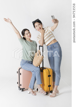 preparing for a summer trip concept series_korean beautiful asian young women taking a selfie 94753558