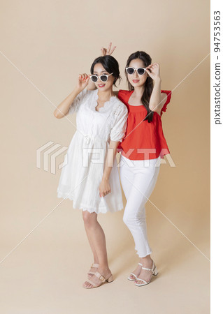 summer vacation trip with friends concept series_korean beautiful asian young women wearing sunglasses having fun time 94753563