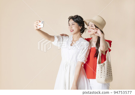 summer vacation trip with friends concept series_korean beautiful asian young women taking a selfie summer vacation trip with friends concept series_korean beautiful asian young women taking a selfie 94753577