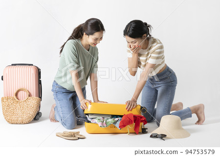 preparing for a summer trip concept series_korean beautiful asian young women packing for a trip preparing for a summer trip concept series_korean beautiful asian young women packing for a trip 94753579