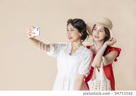 summer vacation trip with friends concept series_korean beautiful asian young women taking a selfie summer vacation trip with friends concept series_korean beautiful asian young women taking a selfie 94753582