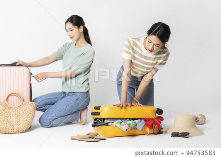 preparing for a summer trip concept series_korean beautiful asian young women packing for a trip preparing for a summer trip concept series_korean beautiful asian young women packing for a trip 94753583