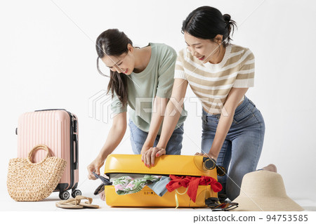 preparing for a summer trip concept series_korean beautiful asian young women packing for a trip 94753585