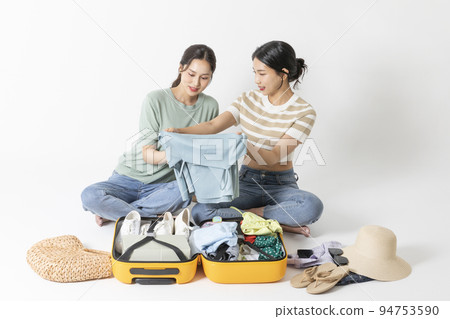 preparing for a summer trip concept series_korean beautiful asian young women packing for a trip preparing for a summer trip concept series_korean beautiful asian young women packing for a trip 94753590