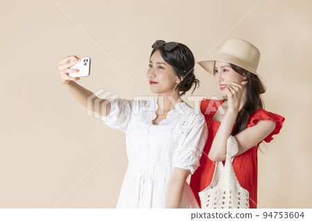 summer vacation trip with friends concept series_korean beautiful asian young women taking a selfie summer vacation trip with friends concept series_korean beautiful asian young women taking a selfie 94753604
