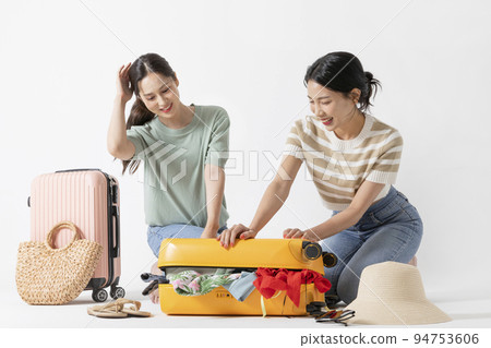 preparing for a summer trip concept series_korean beautiful asian young women packing for a trip preparing for a summer trip concept series_korean beautiful asian young women packing for a trip 94753606