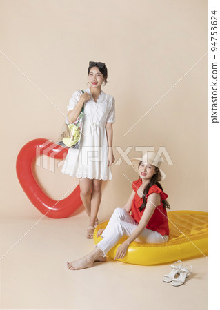 summer vacation trip with friends concept series_korean beautiful asian young women sitting on pool floats summer vacation trip with friends concept series_korean beautiful asian young women sitting on pool floats 94753624