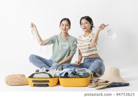preparing for a summer trip concept series_korean beautiful asian young women holding masks preparing for a summer trip concept series_korean beautiful asian young women holding masks 94753625