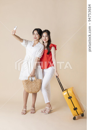 summer vacation trip with friends concept series_korean beautiful asian young women taking a selfie with carrier summer vacation trip with friends concept series_korean beautiful asian young women taking a selfie with carrier 94753684