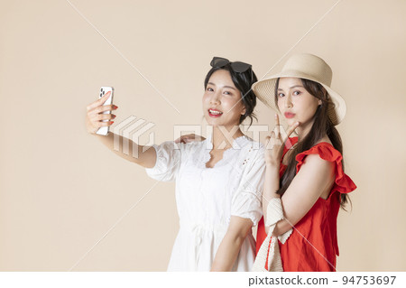 summer vacation trip with friends concept series_korean beautiful asian young women taking a selfie summer vacation trip with friends concept series_korean beautiful asian young women taking a selfie 94753697