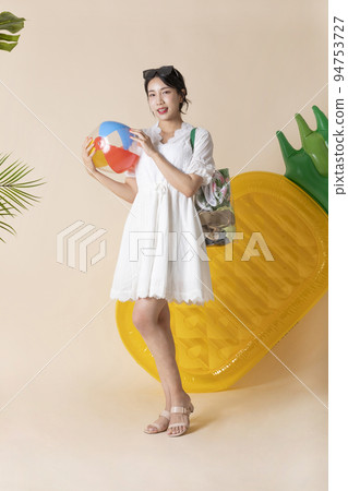 summer vacation trip with friends concept series_korean beautiful asian young woman holding a pool float ball summer vacation trip with friends concept series_korean beautiful asian young woman holding a pool float ball 94753727