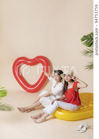 summer vacation trip with friends concept series_korean beautiful asian young women sitting on pool floats summer vacation trip with friends concept series_korean beautiful asian young women sitting on pool floats 94753759