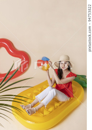 summer vacation trip with friends concept series_korean beautiful asian young women sitting on pool floats 94753822