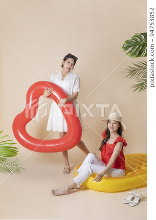 summer vacation trip with friends concept series_korean beautiful asian young women sitting on pool floats summer vacation trip with friends concept series_korean beautiful asian young women sitting on pool floats 94753852