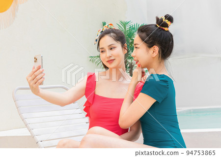 summer vacation trip with friends concept series_korean beautiful asian young women taking a selfie 94753865