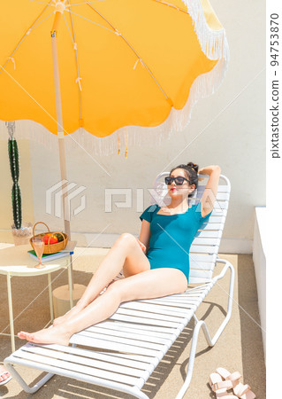 summer vacation trip with friends concept series_korean beautiful asian young women taking a rest on the sunbed summer vacation trip with friends concept series_korean beautiful asian young women taking a rest on the sunbed 94753870