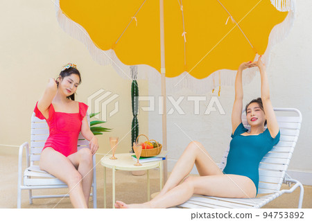 summer vacation trip with friends concept series_korean beautiful asian young women taking a rest on the sunbed summer vacation trip with friends concept series_korean beautiful asian young women taking a rest on the sunbed 94753892