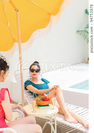 summer vacation trip with friends concept series_korean beautiful asian young women taking a rest on the sunbed summer vacation trip with friends concept series_korean beautiful asian young women taking a rest on the sunbed 94753978