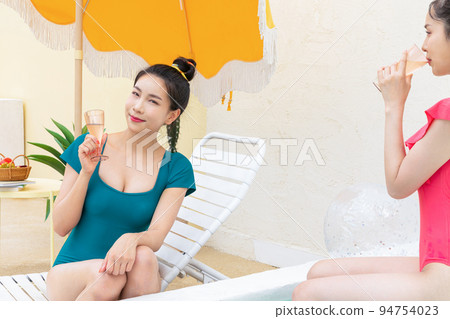 summer vacation trip with friends concept series_korean beautiful asian young women drinking champagne summer vacation trip with friends concept series_korean beautiful asian young women drinking champagne 94754023